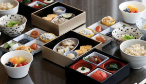 Guests can enjoy a bento-style Japanese breakfast made from sustainably-sourced ingredients served right to their room